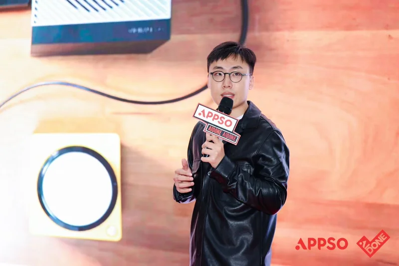 Holding an APPSO-branded microphone, pitching on stage at a product showcase